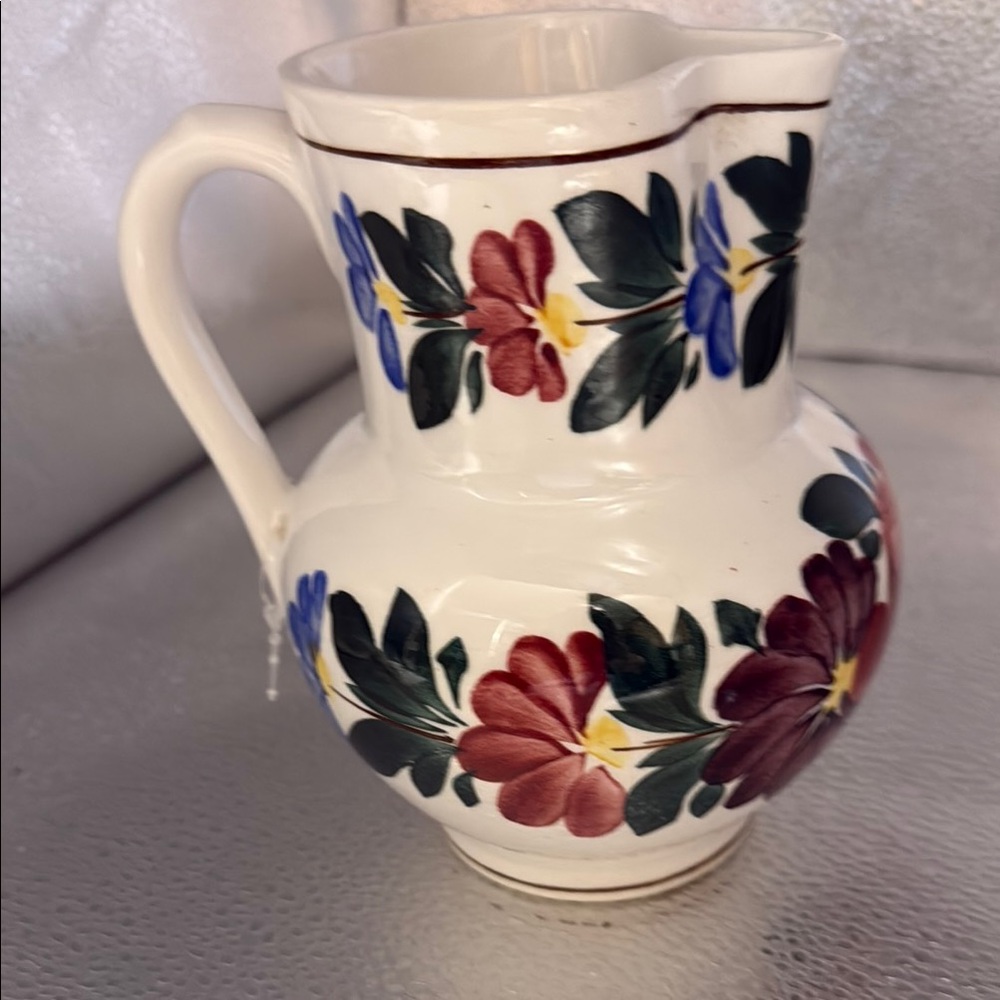 Vintage hand painted floral pitcher from Hungary.